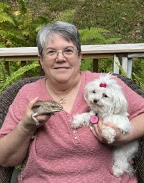 Laura Laura holding a pet
