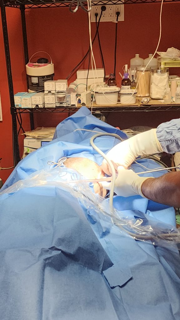 Surgeon performs dental procedure. Surgeon performs dental procedure.